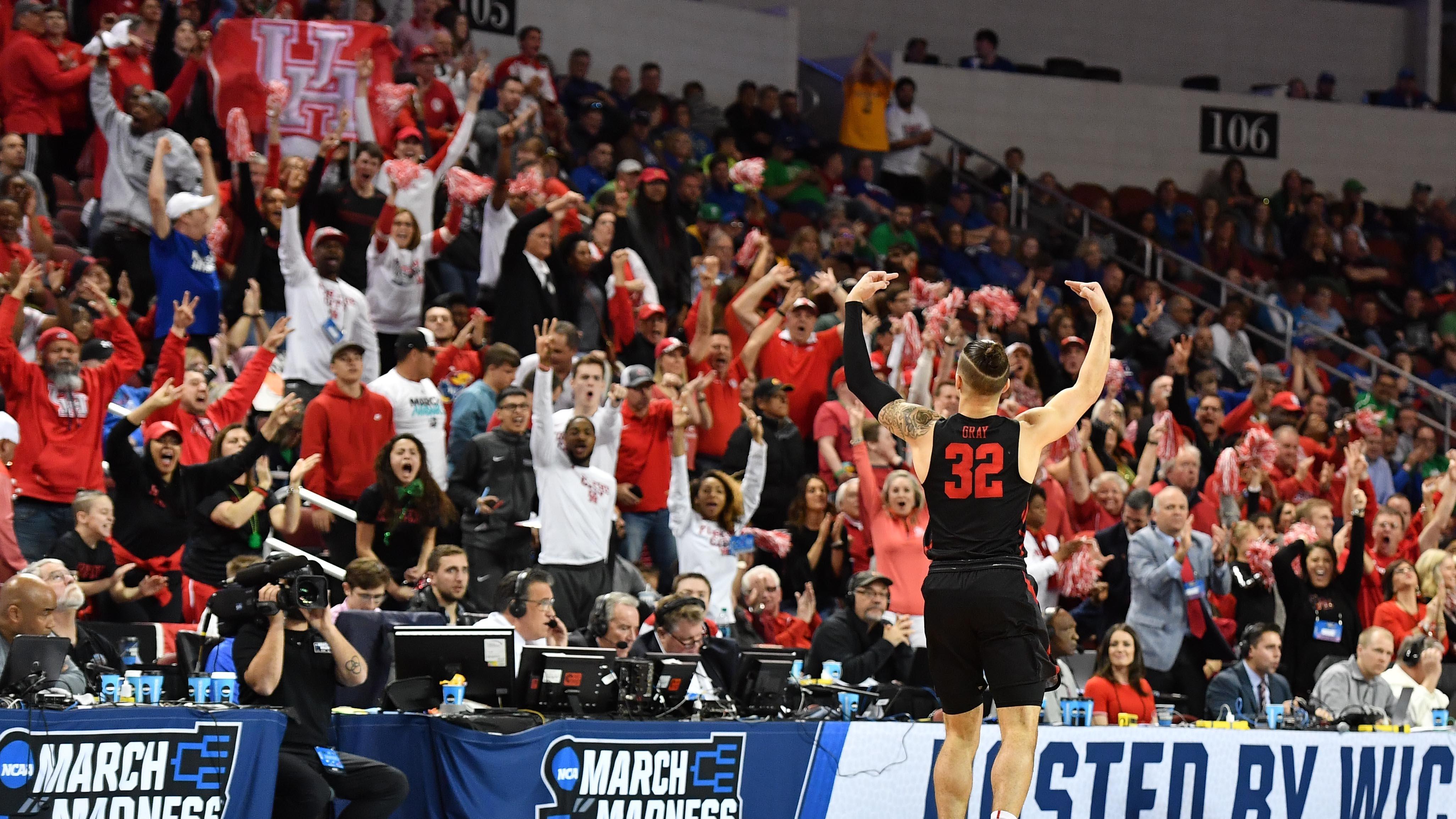 Former Houston guard Rob Gray celebrates with Cougars fans