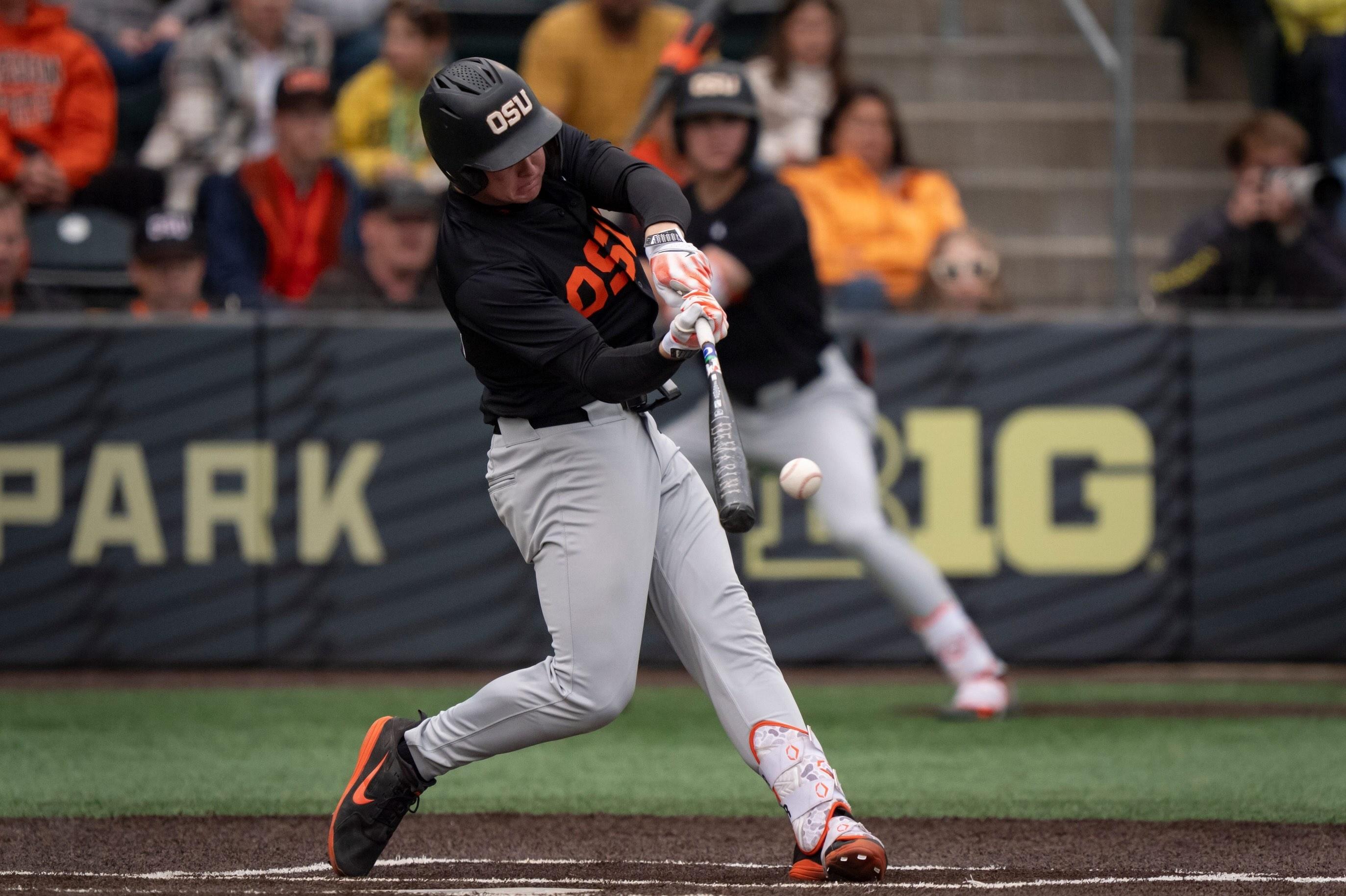 Oregon State infielder Trent Caraway hits a double