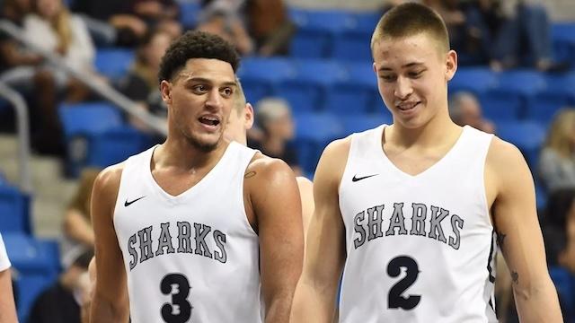A young Nick Smith with senior David Dennis smile as Nova Southeastern's turnaround begins.