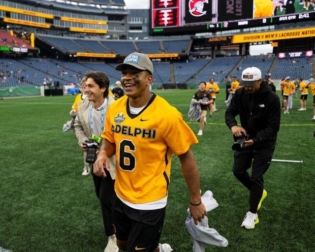 Kyle Lewis heads off the field after another DII men's lacrosse championship.